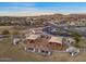 Aerial view of a park showcasing picnic tables, covered play structures, and landscaping at 13583 S 177Th Ln, Goodyear, AZ 85338