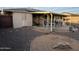 Cozy covered patio with outdoor seating in a gravel backyard at 13846 N Tan Tara Dr, Sun City, AZ 85351