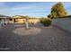 Large gravel backyard featuring desert landscaping, and multiple seating areas at 13846 N Tan Tara Dr, Sun City, AZ 85351