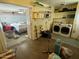 Partially cluttered garage with washer and dryer at 13846 N Tan Tara Dr, Sun City, AZ 85351