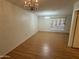 Living room features hardwood-look flooring and chandelier at 13846 N Tan Tara Dr, Sun City, AZ 85351