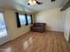 Living room features hardwood-look flooring and sofa at 13846 N Tan Tara Dr, Sun City, AZ 85351