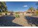 This private backyard features low-maintenance desert landscaping and block wall fencing at 13914 W Terra Vista Dr, Sun City West, AZ 85375