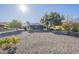 The expansive backyard includes desert landscaping, a fountain and a screened-in porch at 13914 W Terra Vista Dr, Sun City West, AZ 85375