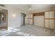 Carpeted bedroom with a ceiling fan, mirrored closet doors, and built-in storage shelves and cabinets at 13914 W Terra Vista Dr, Sun City West, AZ 85375