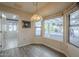 Cozy breakfast nook with a pendant light fixture and bright windows overlooking the exterior at 13914 W Terra Vista Dr, Sun City West, AZ 85375