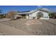 Charming single-story home featuring a two-car garage and low-maintenance desert landscaping at 13914 W Terra Vista Dr, Sun City West, AZ 85375