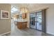 Eat-in kitchen featuring skylights and sliding glass doors to the covered patio, perfect for entertaining at 13914 W Terra Vista Dr, Sun City West, AZ 85375