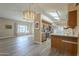 Open kitchen featuring a peninsula, modern stainless steel appliances, and ample storage space at 13914 W Terra Vista Dr, Sun City West, AZ 85375