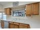 Well-lit kitchen featuring oak cabinets, bright countertops, and stainless steel appliances at 13914 W Terra Vista Dr, Sun City West, AZ 85375