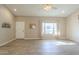 Spacious living room with wood-look floors, a large window and a bright neutral palette at 13914 W Terra Vista Dr, Sun City West, AZ 85375