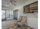 Covered patio featuring tiled flooring, neutral paint, and outdoor seating, perfect for relaxation and enjoying the outdoors at 13914 W Terra Vista Dr, Sun City West, AZ 85375