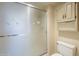 Shower with frosted glass and cabinets in a bathroom at 13914 W Terra Vista Dr, Sun City West, AZ 85375