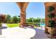 View of backyard with an outdoor seating area and well-manicured landscaping at 1440 N 40Th St # 4, Mesa, AZ 85205