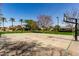 Community basketball court with trees and single Gathering homes in the background at 1440 N 40Th St # 4, Mesa, AZ 85205