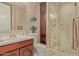 Elegant bathroom showcasing a glass shower and charming vanity at 1440 N 40Th St # 4, Mesa, AZ 85205