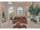 Bright living room featuring large arched windows, comfortable seating, and a stylish coffee table at 1440 N 40Th St # 4, Mesa, AZ 85205