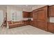 Cozy living room featuring custom wood cabinets and window seat at 1440 N 40Th St # 4, Mesa, AZ 85205