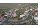 An aerial view of a neighborhood in the hills with custom houses, desert landscaping and tile roofs at 15101 E Aspen Dr, Fountain Hills, AZ 85268