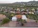 Stunning property featuring a red tile roof, three-car garage, desert landscaping, and privacy from neighbors at 15101 E Aspen Dr, Fountain Hills, AZ 85268