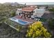 Expansive property showcasing the in-ground pool, outdoor living area, and the main residence with red tile roof at 15101 E Aspen Dr, Fountain Hills, AZ 85268