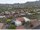 Aerial view of a desert home with a pool, patio, and three-car garage at 15101 E Aspen Dr, Fountain Hills, AZ 85268