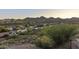 Neighborhood houses nestled into hills with mountains in the background at 15101 E Aspen Dr, Fountain Hills, AZ 85268