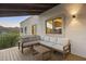 Outdoor seating area on a covered balcony with scenic views of the desert landscape at 15101 E Aspen Dr, Fountain Hills, AZ 85268