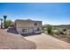 Back exterior of a modern two-story house with desert landscaping, pool and attached two-car garage at 15101 E Aspen Dr, Fountain Hills, AZ 85268