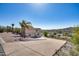 Two-story home featuring a desert landscape and a large driveway leading to an attached two-car garage at 15101 E Aspen Dr, Fountain Hills, AZ 85268