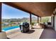 Back patio with pool and mountain views. Outdoor kitchen and eating area at 15101 E Aspen Dr, Fountain Hills, AZ 85268