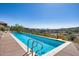 Inviting pool, fenced for safety, with stunning views of the surrounding area at 15101 E Aspen Dr, Fountain Hills, AZ 85268