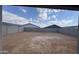 Large backyard enclosed with block fencing, ready for landscaping and outdoor enjoyment at 15761 W Beryl Ave, Waddell, AZ 85355