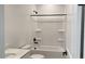 Bathroom with a shower and tub combo, black hardware, and a granite countertop at 15761 W Beryl Ave, Waddell, AZ 85355