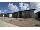 Charming single-story home with a two-car garage, low maintenance desert landscaping, and paver driveway at 15761 W Beryl Ave, Waddell, AZ 85355