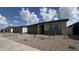 A row of single-story homes featuring low-maintenance landscaping and two-car garages at 15761 W Beryl Ave, Waddell, AZ 85355