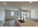 Modern kitchen with an island with a black faucet and open living space at 15761 W Beryl Ave, Waddell, AZ 85355