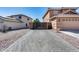 View of home from brick paved driveway at 162 N 225Th Dr, Buckeye, AZ 85326