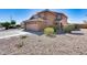 Charming two-story home featuring a two-car garage and low maintenance desert landscaping at 162 N 225Th Dr, Buckeye, AZ 85326