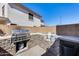 Outdoor kitchen with grill and stone countertop at 162 N 225Th Dr, Buckeye, AZ 85326