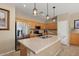 Modern kitchen featuring wood cabinets, stainless steel appliances, and a center island at 16351 W Central St, Surprise, AZ 85388