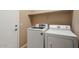 Functional laundry room with a modern washer and dryer for convenient chores at 16351 W Central St, Surprise, AZ 85388