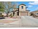 Charming two-story home with a well-maintained front yard, stone accents, and a two-car garage at 17190 W Bent Tree Dr, Surprise, AZ 85387