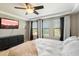 Serene main bedroom featuring neutral tones, a ceiling fan, and ample natural light at 17190 W Bent Tree Dr, Surprise, AZ 85387