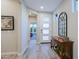 Inviting foyer featuring tile floors, console table with mirror, and lots of natural light at 17721 E Bismark Lake Ct, Rio Verde, AZ 85263