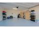 Spacious garage with epoxy flooring, storage shelves, and ample room for vehicles and equipment at 17721 E Bismark Lake Ct, Rio Verde, AZ 85263