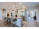 Modern kitchen featuring a large island with seating and stainless steel appliances at 17721 E Bismark Lake Ct, Rio Verde, AZ 85263