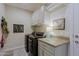 Well-organized laundry room with ample storage, modern appliances, and stylish decor at 17721 E Bismark Lake Ct, Rio Verde, AZ 85263