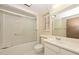 Well-lit bathroom featuring a shower-tub combination, a single vanity, and a window for natural light at 18034 N Highwood Ct, Sun City, AZ 85373