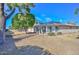 Cozy single-story home featuring a well-maintained lawn and a covered sunroom, creating an inviting outdoor living space at 18034 N Highwood Ct, Sun City, AZ 85373